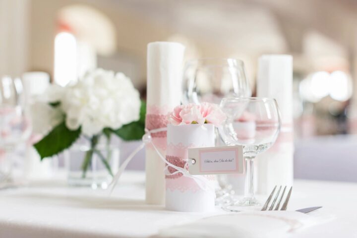 wedding table set with candles and wine glass